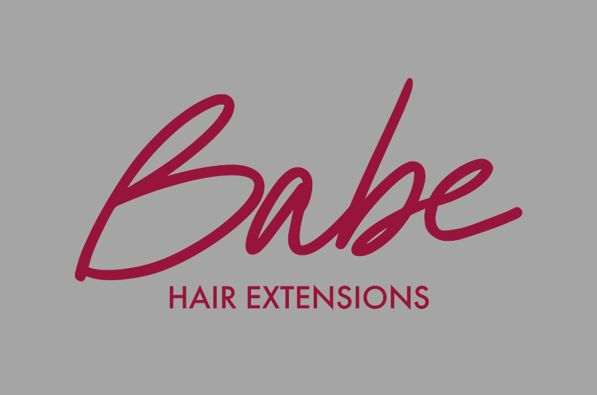 Babe Hair Extensions logo with maroon text on a dark grey background.