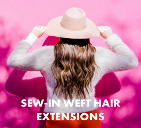 The back of a lady is wearing a hat holding it, in a white sweater with text reading "sew-in weft hair extensions" on a pink background.